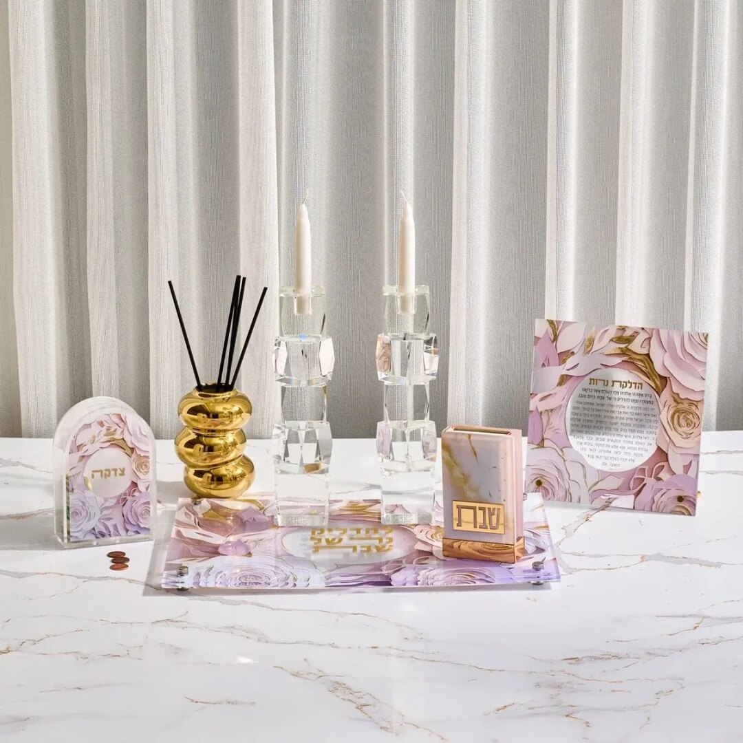 Decorative Judaica and candlesticks arranged on a table